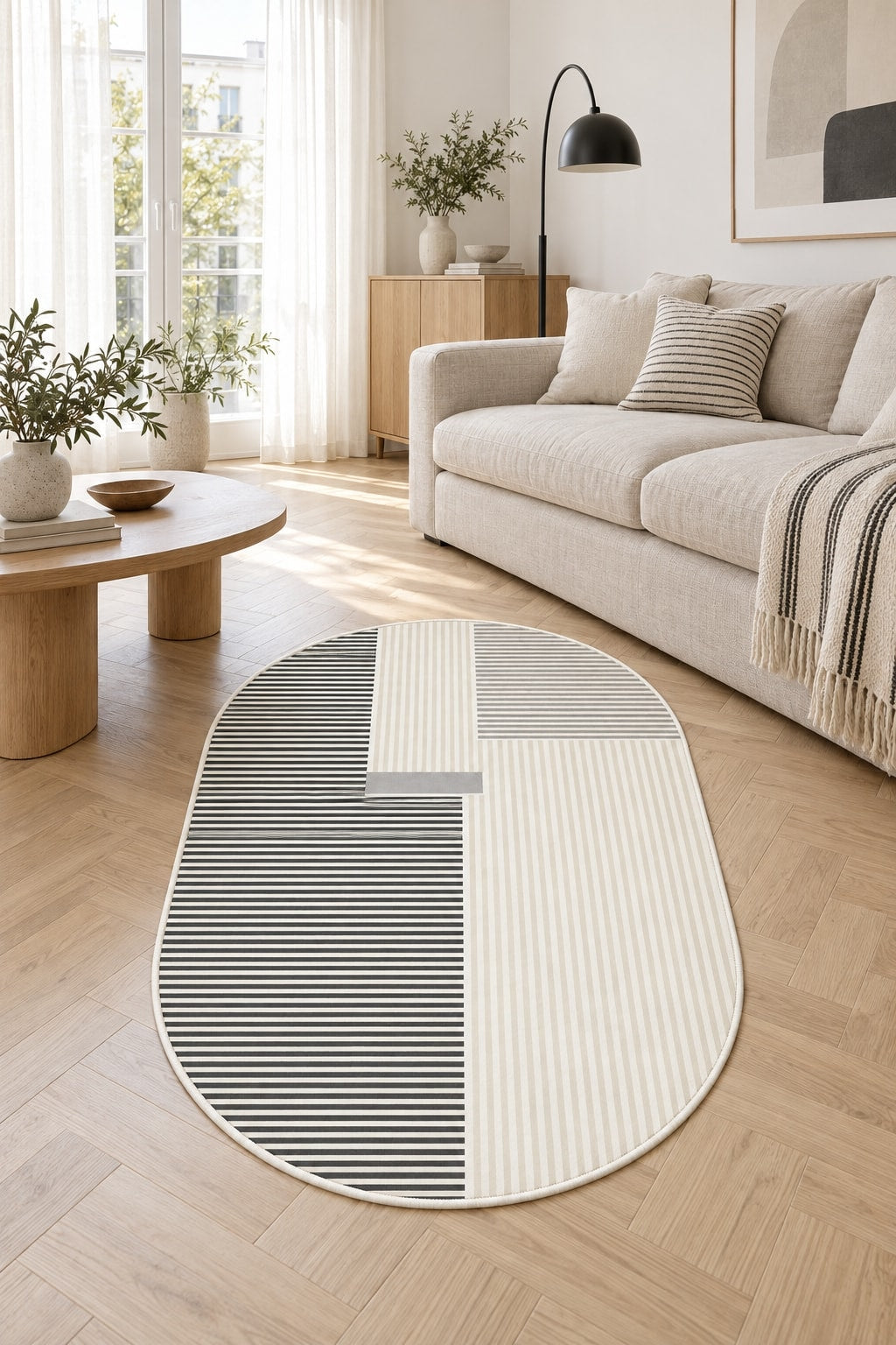 Striped Modern Oval Rug – Gray in a living room