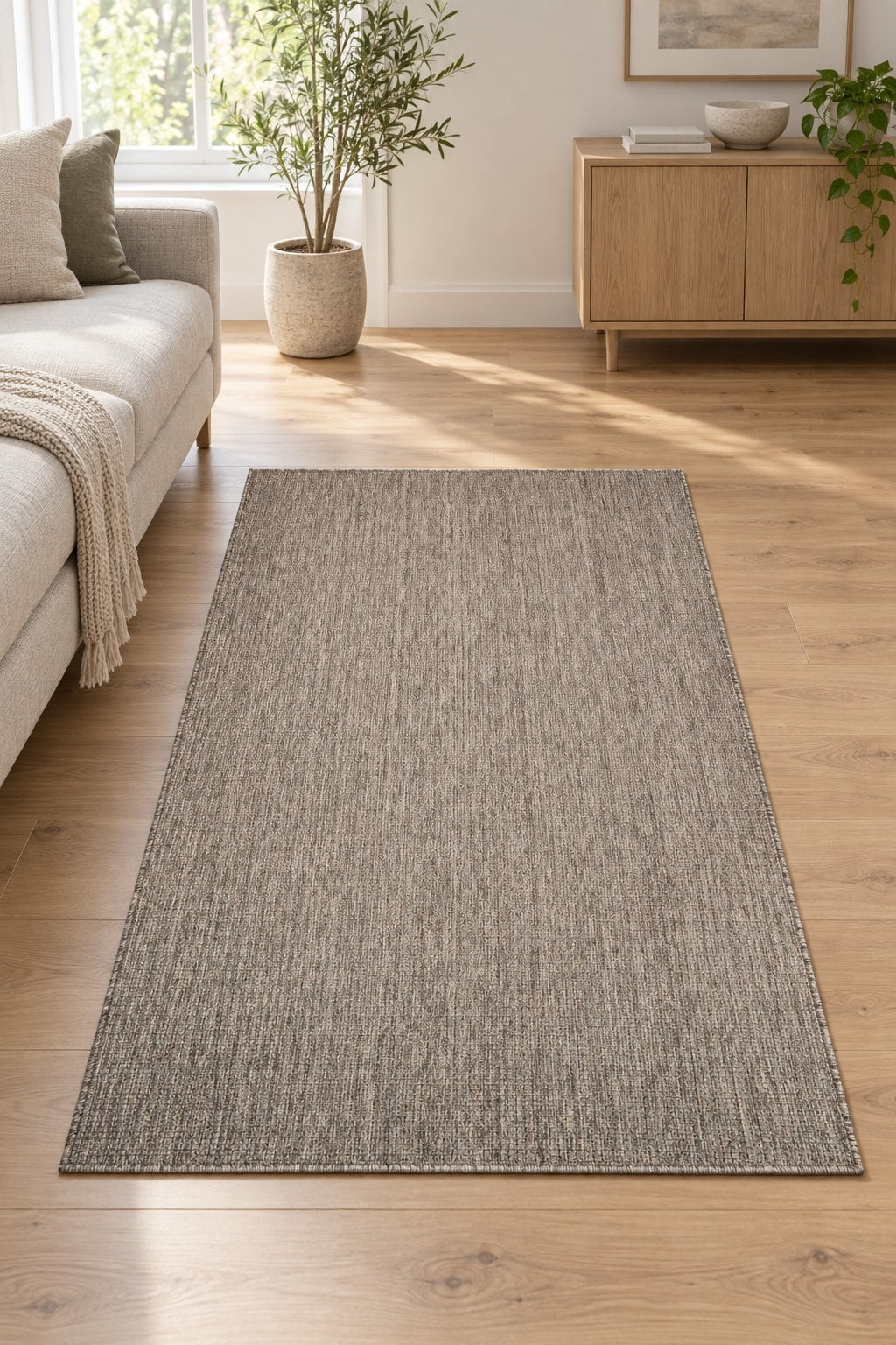 Woven Boho Area Rug – Gray in a living room
