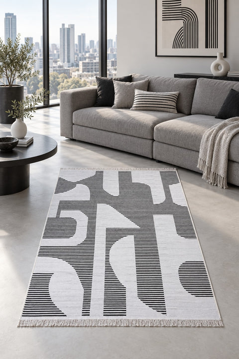 Abstract Boho Area Rug – Black & White in a living room