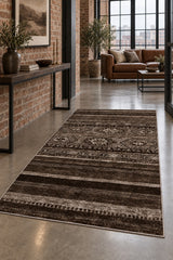 Abstract Ethnic Area Rug – Brown in a hallway