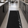 Abstract Modern Kitchen Rug – Black in a kitchen