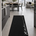 Abstract Modern Kitchen Rug – Black in a dining room