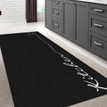 Abstract Modern Kitchen Rug – Black in a kitchen