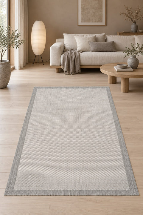 Border Modern Kitchen Rug – Charcoal & Ecru in a living room