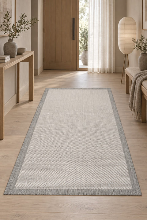 Border Modern Kitchen Rug – Charcoal & Ecru in a hallway