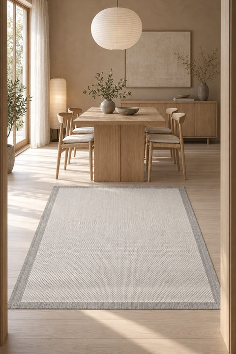 Border Modern Kitchen Rug – Charcoal & Ecru in a dining room