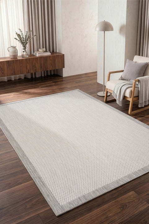 Border Modern Kitchen Rug – Charcoal & Ecru in a living room
