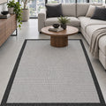 Border Modern Kitchen Rug – Ecru & Black in a living room