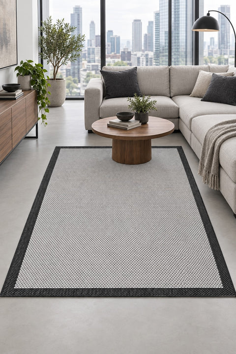 Border Modern Kitchen Rug – Ecru & Black in a living room
