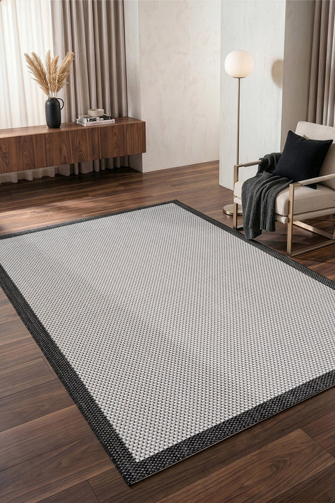 Border Modern Kitchen Rug – Ecru & Black in a living room