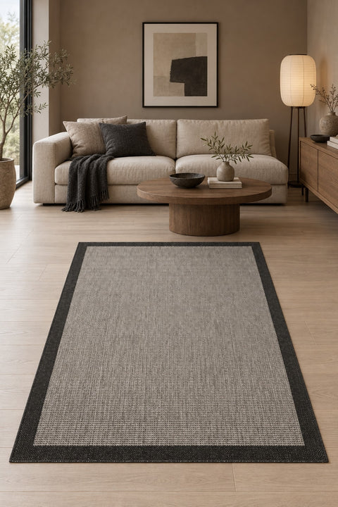 Bordered Modern Kitchen Rug – Black in a living room