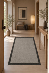 Bordered Modern Kitchen Rug – Black in a hallway