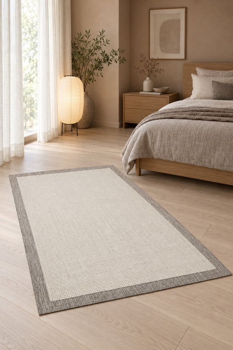 Bordered Modern Kitchen Rug – Cream & Gray in a bedroom