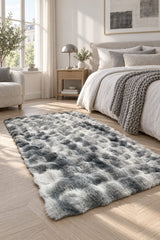 Bubble Checkered Boho Area Rug – Gray & Cream in a bedroom
