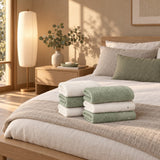 Dotted Cotton Guest Towel Set of 6 – Green & Ecru in a bedroom