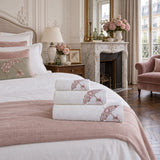 Embroidered Cotton Bath Towel Set of 3 – Cream in a bedroom