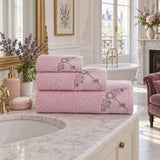 Embroidered Cotton Bath Towel Set of 3 – Pink in a bathroom