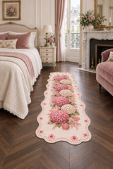 Floral Modern Oval Kitchen Rug – Pink in a bedroom