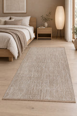 Geometric Boho Area Rug – Beige in a bedroom