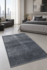 Geometric Boho Area Rug – Charcoal in a bedroom