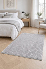Geometric Boho Area Rug – Gray in a bedroom