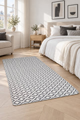 Geometric Modern Kilim Area Rug – Gray in a bedroom