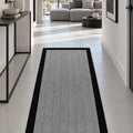 Geometric Modern Kitchen Rug – Gray in a hallway