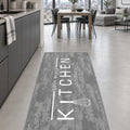 Geometric Modern Kitchen Rug – Gray in a dining room