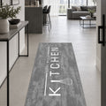Geometric Modern Kitchen Rug – Gray in a hallway