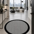 Geometric Modern Round Kitchen Rug – Gray in a hallway