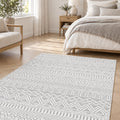 Geometric Scandinavian Area Rug – Gray in a bedroom