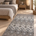 Loop Geometric Area Rug – Beige & Charcoal in a bedroom