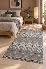 Loop Geometric Area Rug – Beige & Charcoal in a bedroom