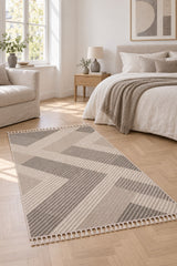 Loop Geometric Area Rug – Gray & Beige in a bedroom