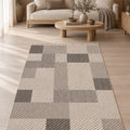 Loop Geometric Area Rug – Taupe & Gray in a living room