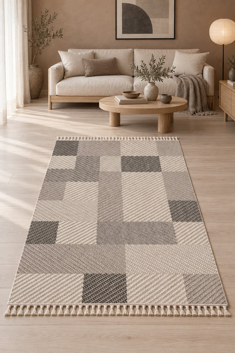 Loop Geometric Area Rug – Taupe & Gray in a living room