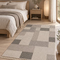 Loop Geometric Area Rug – Taupe & Gray in a bedroom