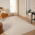 Looped Modern Area Rug – Cream 2 in a living room