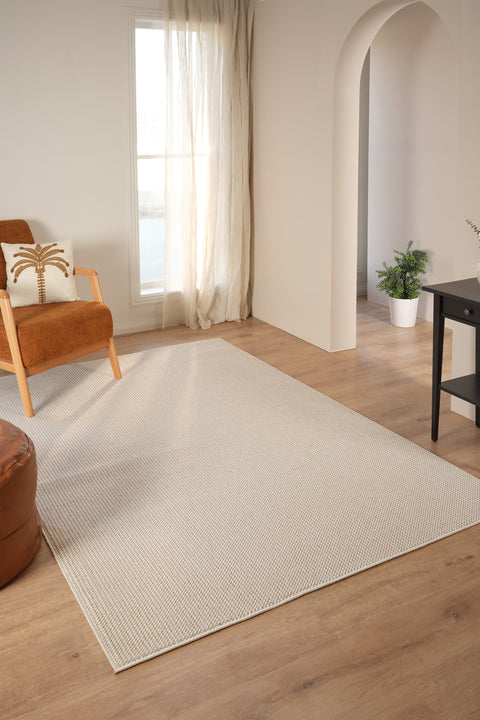 Looped Modern Area Rug – Cream 2 in a living room
