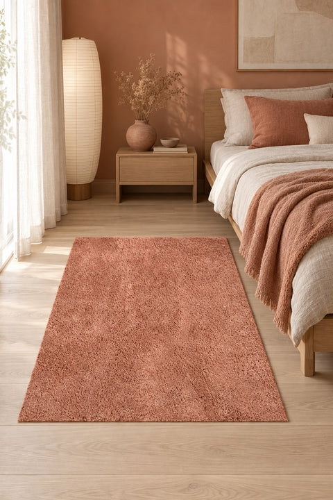 Mest Modern Plush Area Rug – Salmon in a bedroom