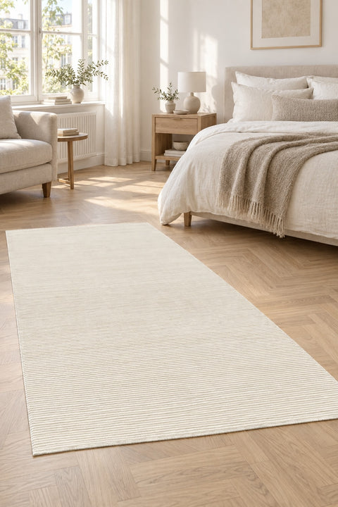 Mystic Modern Area Rug – Cream in a bedroom