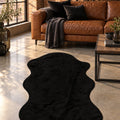 Plush Shag Kids Oval Rug – Black in a living room