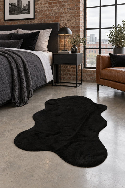 Plush Shag Kids Oval Rug – Black in a bedroom