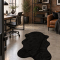 Plush Shag Kids Oval Rug – Black in a office