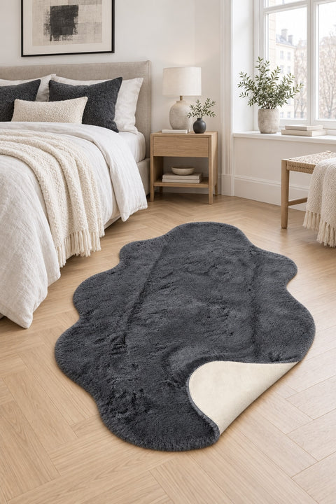 Plush Shag Kids Oval Rug – Charcoal in a bedroom