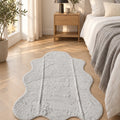 Plush Shag Kids Oval Rug – Gray in a bedroom