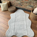 Plush Shag Kids Oval Rug – Gray in a living room