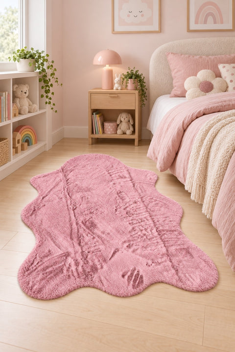Plush Shag Kids Oval Rug – Pink in a bedroom