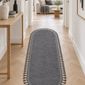Puffy Geometric Boho Oval Rug – Charcoal in a hallway