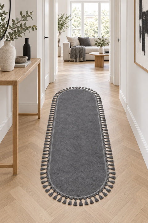Puffy Geometric Boho Oval Rug – Charcoal in a hallway
